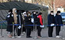 People line up to be tested for the COVID-19 coronavirus outside a hospital in Beijing on 28 January 2021. Picture: Greg Baker/AFP