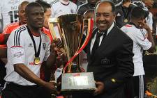 Orlando Pirates captain Lucky Lekgwathi and coach Augusto Palacios with the Carling Black Label Cup. Picture: Taurai Maduna/EWN