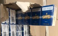Some of the illicit cigarettes seized by police in Eldorado Park, Johannesburg, on 17 August 2020. Picture: @SAPoliceService/Twitter