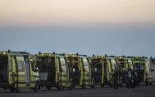 Egyptian ambulances line up at Kabret military air base by the Suez Canal on 31 October 2015, after victims of a Russian airliner that crashed in the Sinai Peninsula were brought to the base before being transported to a morgue. Picture: AFP 