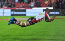 Lions player Lionel Mapoe dives to score a try, during a Super Rugby match against the Sharks on 2 June 2012. Picture: Marc Lewis/EWN