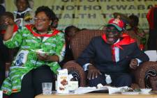 FILE: Zimbabwe’s President Robert Mugabe and Vice President Joice Mujuru attend a rally marking Mugabe’s 88th birthday in Mutare on 25 February, 2012. Picture: AFP.