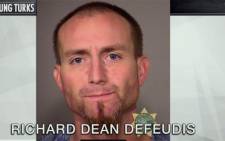 A screengrab showing an Oregon burglar, Richard Dean Defeudis, who broke into a couple's house and stripped naked and climbed into their bed with them.