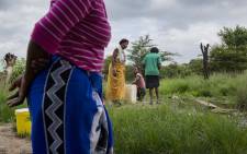 Dididi community members collect water at a stream. Picture: Sthembiso Zulu/EWN