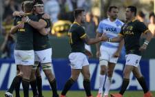 The Springboks celebrate after defeating Argentina's Los Pumas by 33 to 31 in the Rugby Championship second round match at Padre Ernesto Martearena stadium in Salta on 23 August 2014. Picture: AFP/ Juan Mabromata