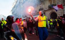 FILE: Protesters demonstrate on the Faugbourg Saint-Honore street in Paris on 17 November 2018, during a nationwide popular initiated day of protest called 'yellow vest' (Gilets Jaunes in French) movement to protest against high fuel prices which has mushroomed into a widespread protest against stagnant spending power under French President. Picture: AFP