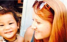 Mia Lindeque in picture with a child from Nepal.Picture Mia Lindeque/EWN