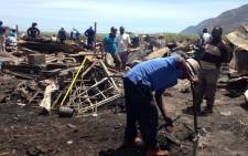 FILE: Masiphumelele residents rebuild following a shack fire. Picture: Shamiela Fisher/EWN.
