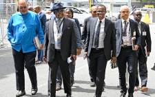 Minister of Finance Enoch Godongwana (wearing hat), joined by members of his executive, Deputy Minister David Masondo (second from right), SARS commissioner Edward Kieswater (blue shirt), Reserve Bank Governor Lesetja Kganyago and Treasury Director-General Duncan Pieterse (first from right) arrive at the Cape Town City Hall For the MTBPS on 1 November 2023. Picture: @ParliamentofRSA/X