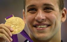 Chad le Clos with his gold medal after winning the 200m butterfly final in the Olympics. Picture: AFP.