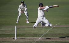 England's Ollie Pope (R) jumps in the air after playing a shot during the first day of the third Test cricket match between South Africa and England at the St George's Park Cricket Ground in Port Elizabeth on 16 January 2020. Picture: AFP