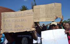 Community members protest outside the Benoni Magistrate's Court on 4 March 212, where nine police officers appeared for the death of taxi driver Mido Macia. Picture: EWN.