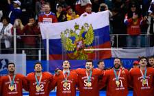 The Olympic Athletes from Russia's players sing the Russia national anthem after receiving their gold medals after the men's gold medal ice hockey match between the Olympic Athletes from Russia and Germany during the Pyeongchang 2018 Winter Olympic Games. Picture AFP