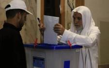 An Iraqi resident of Syria casts her vote for the Iraqi parliamentary elections at a polling station in the city of Sayyida Zeinab on the outskirts of the Syrian capital Damascus on 10 May, 2018. Picture: AFP.