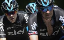 Great Britains Christopher Froome (left) rides behind Great Britains Ian Stannard during the 190.5 km seventh stage of the 102nd edition of the Tour de France cycling race on 10 July 2015, between Livarot and Fougeres, northwestern France. Picture: AFP.