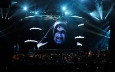  Actor Ian McDiarmid's Emperor Palpatine character from the Star Wars series of films is shown on screen while musicians perform during 'Star Wars: In Concert' at the Orleans Arena 29 May 2010 in Las Vegas, Nevada. Picture: AFP