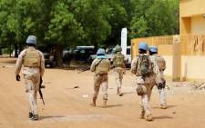 FILE: Senegalese soldiers of the UN peacekeeping mission in Mali MINUSMA (United Nations Multidimensional Integrated Stabilisation Mission in Mali) patrol on foot in the streets of Gao, on 24 July 2019. Picture: AFP