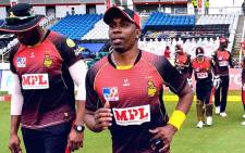 Trinbago Knight Riders' Dwayne Bravo (centre) takes the pitch ahead of a Caribbean Premier League match. Picture: @TKRiders/Twitter