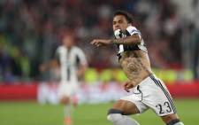 Juventus Defender from Brazil Dani Alves celebrates after scoring during the UEFA Champions League semi final second leg football match Juventus vs Monaco, on 9 May, 2017 at the Juventus stadium in Turin. Picture: AFP.
