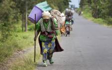 Villagers flee their homes in Sake, in the Democratic Republic of the Congo’s North Kivu province, as fighting erupts between FARDC Government forces and rebel groups. Picture: United Nations Photo.