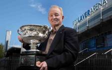 Australian tennis legend Rod Laver poses with the Australia Open trophy. Picture: @AustraliaOpen/Twitter