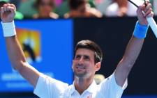 Serbia's Novak Djokovic celebrates after victory in his men's singles match against Russia's Andrey Kuznetsov on day four of the 2015 Australian Open tennis tournament in Melbourne on 22 January, 2015. Picture: AFP.
