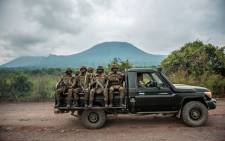 FILE: A Congolese army pick up carrying trooops heads towards the front line near Kibumba in the area surrounding the North Kivu city of Goma on 25 May 2022 during clashes between the Congolese army and M23 rebels. Picture: Arlette Bashizi/AFP