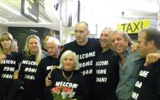 Shani Krebs posing for a picture with his family and friends at O R Tambo