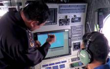 FILE: Malaysian Maritime Enforcement personnel using radar to scan for the missing Malaysia Airlines (MAS) Boeing 777-200 as they fly over the waters off the northeastern coast of peninsula Malaysia. Picture: AFP