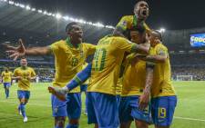 Brazil's Gabriel Jesus (2-R) celebrates with teammates after scoring against Argentina during their Copa America football tournament semifinal match at the Mineirao Stadium in Belo Horizonte, Brazil, on 2 July 2019. Picture: AFP