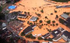 An aerial view of a flooded area in the municipality of Franco da Rocha, some 26 km from Sao Paulo, Brazil, taken on 11 March 2016 after torrential rains killed at least 19 people on the outskirts of the Brazilian economic capital Sao Paulo. Picture: AFP.