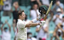 Australia's Steven Smith celebrates after scoring a century (100 runs) during the second day of the third cricket Test match between Australia and India at the Sydney Cricket Ground (SCG) in Sydney on 8 January 2021. Picture: Saeed Khan/AFP