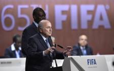 FILE: Former Fifa President Sepp Blatter gestures as he speaks after being re-elected following a vote to decide on the Fifa presidency in Zurich on 29 May, 2015. Picture: AFP.