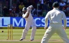 South Africa's batsman Hashim Amla plays a shot from Australia's cricketer Ryan Harris during the second test match between South Africa and Australia at Saint George's Park in Port Elizabeth on February 22, 2014. Picture: AFP.