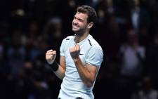 Bulgaria's Grigor Dimitrov celebrates winning his men's singles final match against Belgium's David Goffin on day eight of the ATP World Tour Finals tennis tournament at the O2 Arena in London on 19 November 2017. Dimitrov won the match 7-5, 6-4, 6-3. Picture: AFP.
