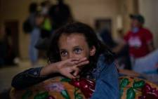 Honduran Ashley, 8, rests at the Hotel Migrante shelter in Mexicali, Mexico, on 24 April, 2018, after arriving with other Central American migrants taking part in the "Migrant Via Crucis" caravan. Picture: AFP