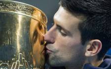 Novak Djokovic of Serbia kisses his trophy after beating Tomas Berdych of the Czech Republic during their men’s singles final at the China Open. Picture: AFP