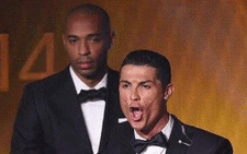 Cristiano Ronaldo winning the Ballon d'Or, with Thierry Henry behind him on 12 January 2015. Picture: Twitter @UberFootFact.