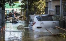 Flooded vehicles are seen in the aftermath of Typhoon Hagibis in Kawasaki on October 13, 2019. Japan's military scrambled October 13 to rescue people trapped by flooding in the aftermath of powerful Typhoon Hagibis, which killed at least four people, caused landslides and burst rivers. Picture: AFP