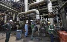 Workers rehabilitate the new Port Harcourt refinery built in 1989 at the same site where the first refinery in Nigeria was built in 1965 in oil rich Port Harcourt, Rivers State. Picture: AFP.