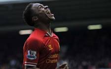 UNITED KINGDOM, Liverpool : Liverpool's English midfielder Raheem Sterling celebrates scoring their fifth goal during the English Premier League football match between Liverpool and Arsenal at Anfield in Liverpool, northwest England, on February 8, 2014. Picture: AFP.