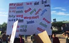 FILE: Children hold up placards with various messages during a march in Eerste River on 6 June, 2015. Picture: Monique Mortlock/EWN.