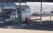 The body of the woman shot dead at the Sangweni taxi rank, witnesses say she was shot in the bus during early morning shootout. Picture: Govan Whittles/EWN.
