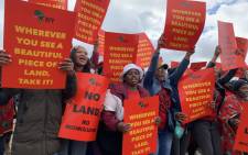 EFF supporters hold placards ahead of the march to Johann Rupert's Remgro offices in Stellenbosch on 6 April 2022. Picture: Kaylynn Palm/Eyewitness News