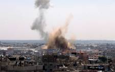Smoke billows following an Israeli air strike in Rafah, in the southern Gaza Strip, on 8 August 2014. Picture: AFP.