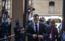 FILE: Oscar Pistorius arrives at the high court in Pretoria to set down a date for new sentencing procedures following the murder of his girlfriend Reeva Steenkamp. Picture: Reinart Toerien/EWN.