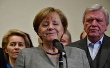 FILE: German Chancellor and leader of the Christian Democratic Union party, Angela Merkel, closes her eyes while speaking after exploratory talks on forming a new government broke down on 19 November 2017 in Berlin. Picture: AFP.