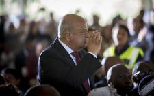 Finance Minister Pravin Gordhan salutes the crowd as they applaud him during the official state funeral of struggle stalwart Ahmed Kathrada on 29 March 2017. Picture: Reinart Toerien/EWN
