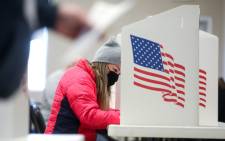 FILE: A voter marks her ballot at Bloomfield United Methodist Church on 3 November 2020 in Des Moines, Iowa. Picture: AFP