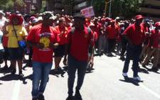 About 1,000 Communication Workers Union members sing and dance in the streets of Johannesburg as they march for a bailout from government. Picture: Kgothatso Mogale/EWN.